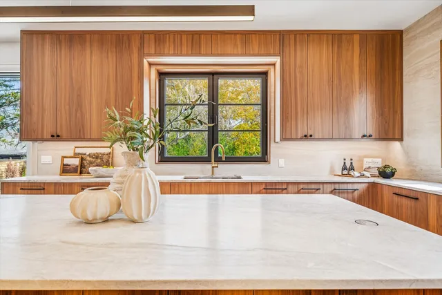 a kitchen with stainless steel appliances a refrigerator and a stove