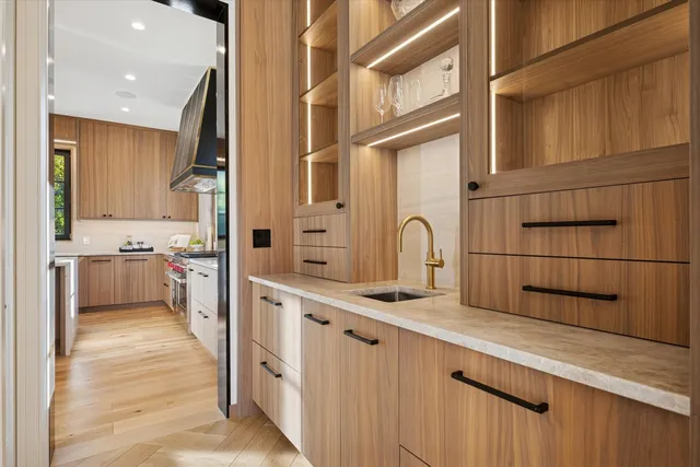 a bedroom with bed and wooden floor