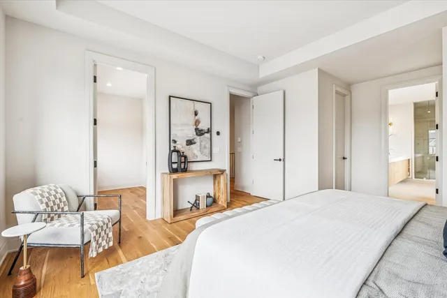 an empty room with a window and wooden floor