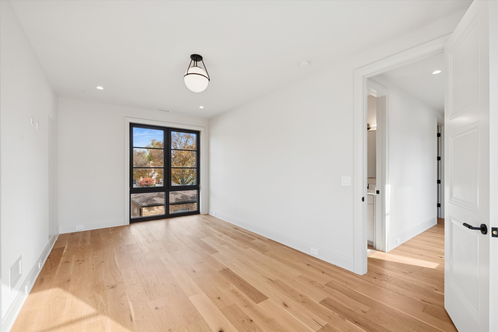 377 Prairie Avenue Elmhurst, IL 60126 - Photo 36 of 64 wooden floor in an empty room with a window