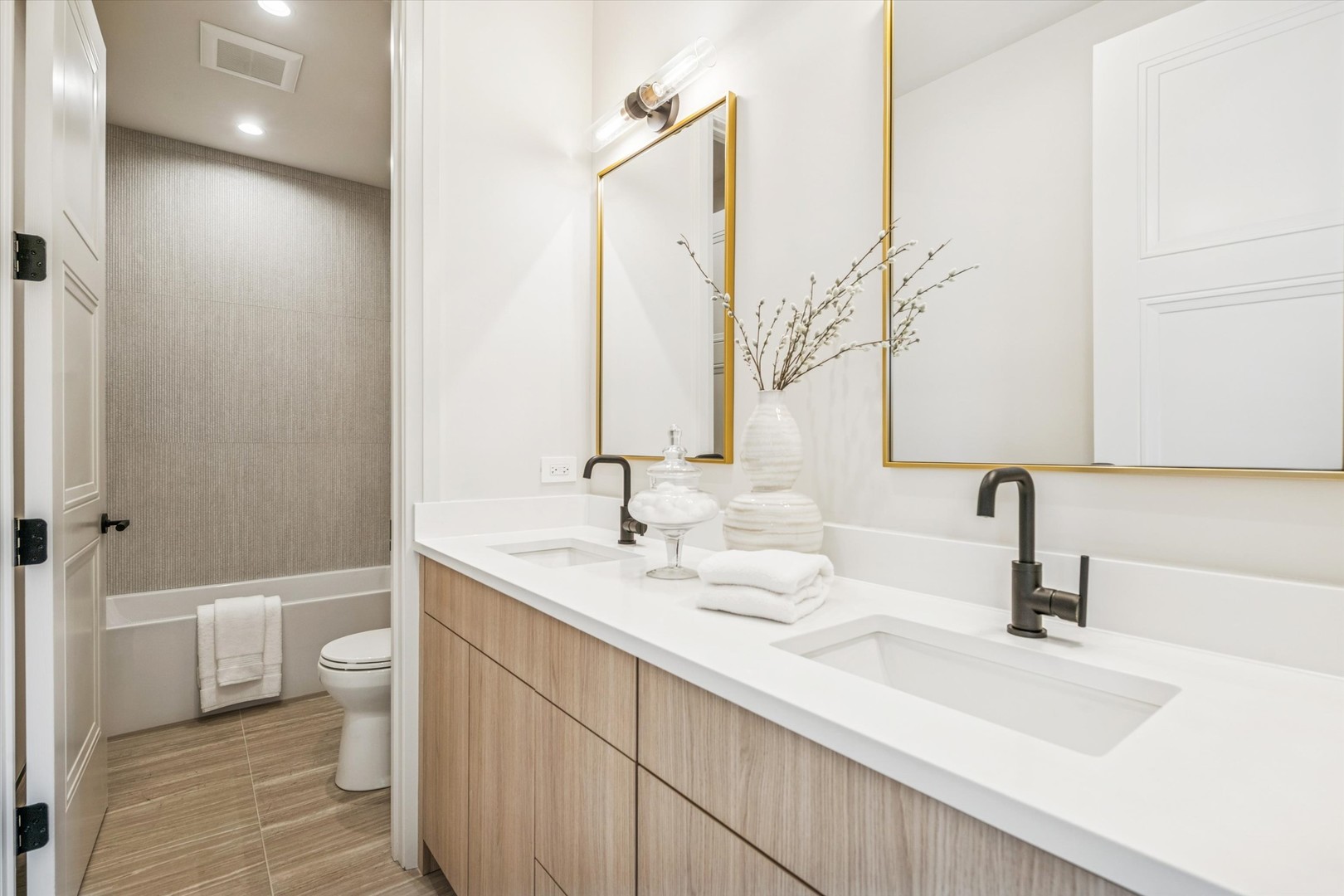377 Prairie Avenue Elmhurst, IL 60126 - Photo 37 of 64 a bathroom with a double vanity sink and a mirror