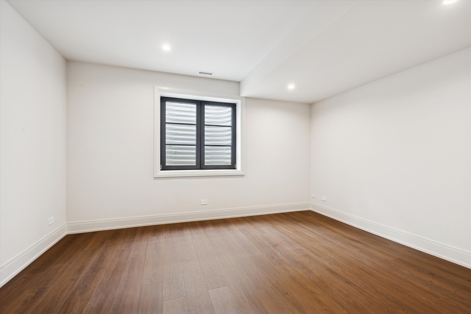 377 Prairie Avenue Elmhurst, IL 60126 - Photo 49 of 64 an empty room with wooden floor and windows