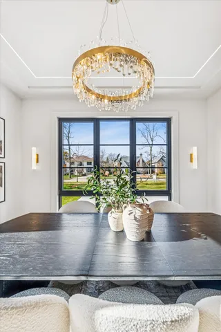 a living room with furniture a window and a table
