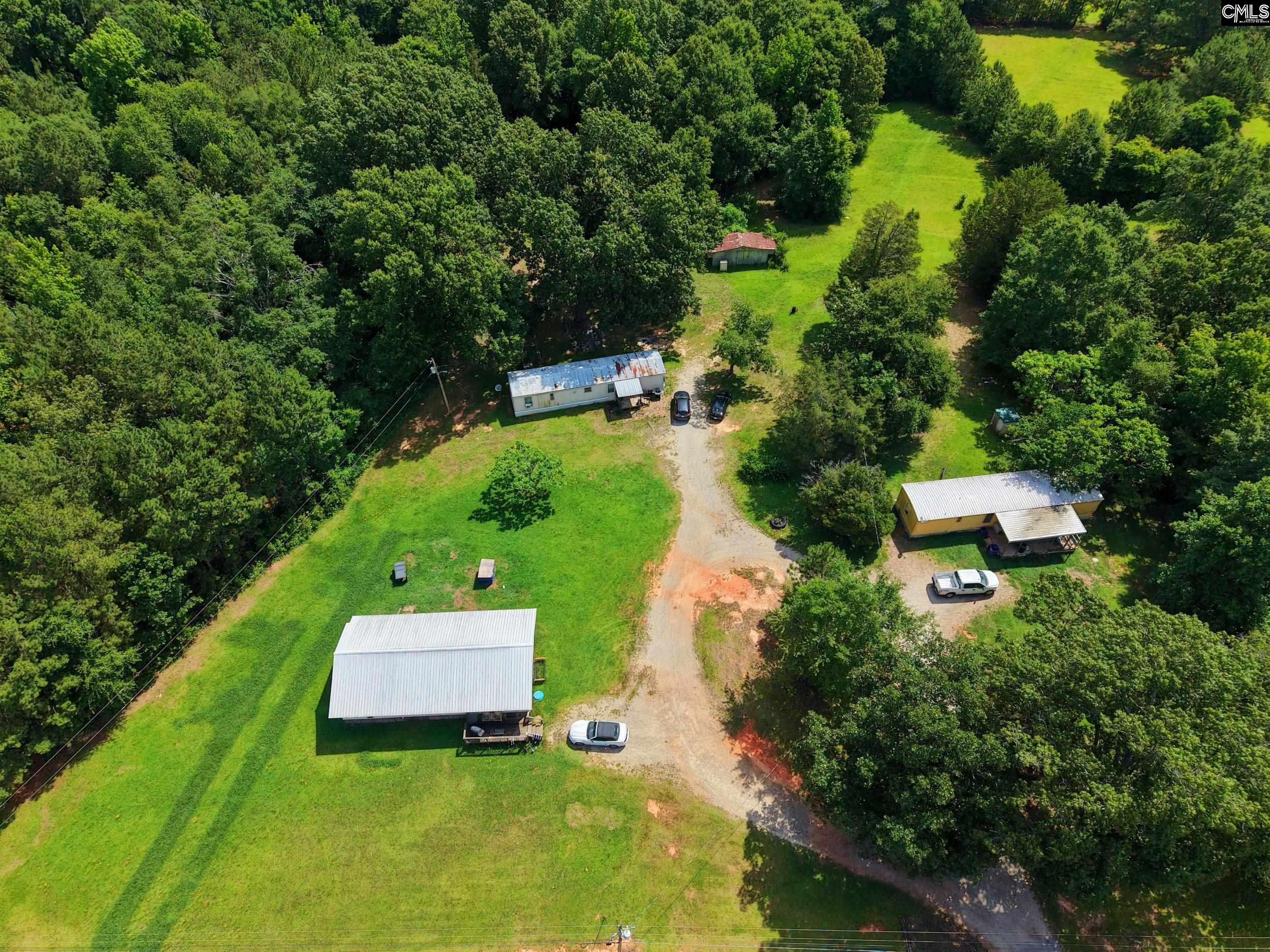 3140 Highway 702 Chappells, SC 29037 - Photo 6 of 39 an aerial view of a house with pool outdoor seating and yard