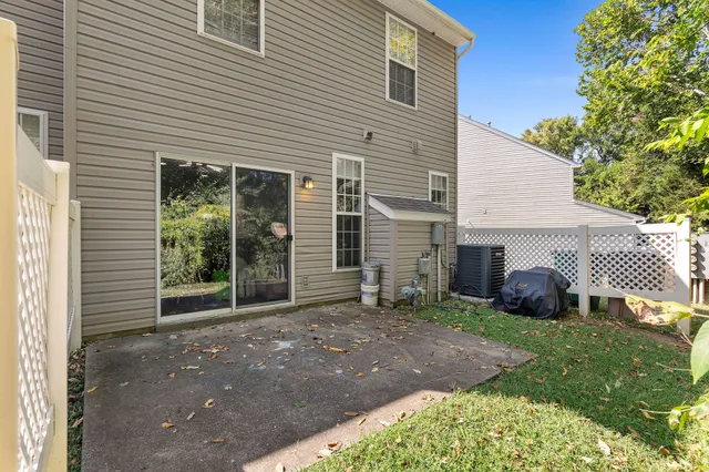 a view of a house with yard and a garage