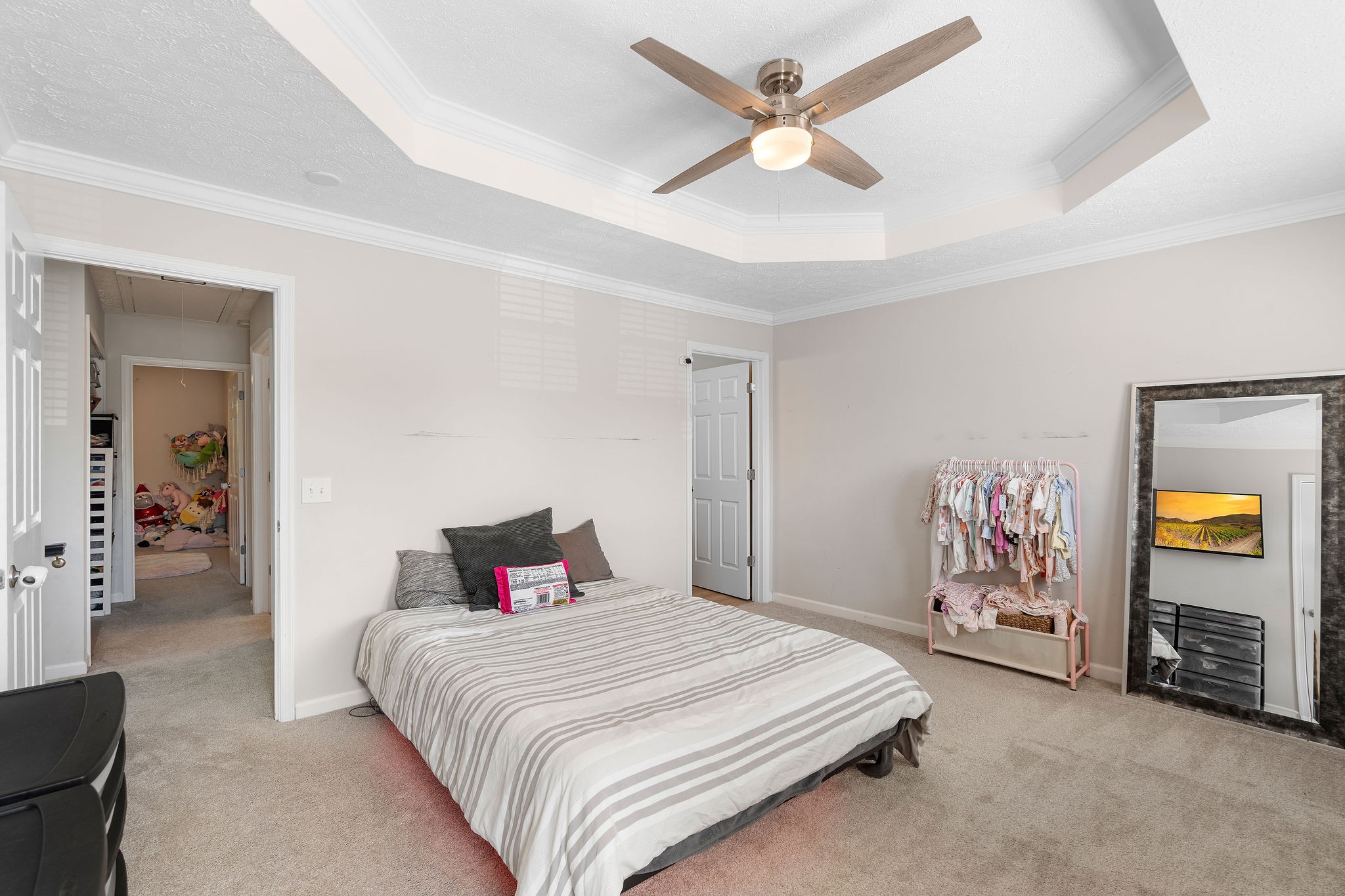 1345 Bell Road, Unit 405 Antioch, TN 37013 - Photo 6 of 14 a bedroom with a large bed and a chandelier