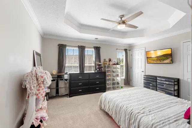 a bedroom with a bed and a dresser