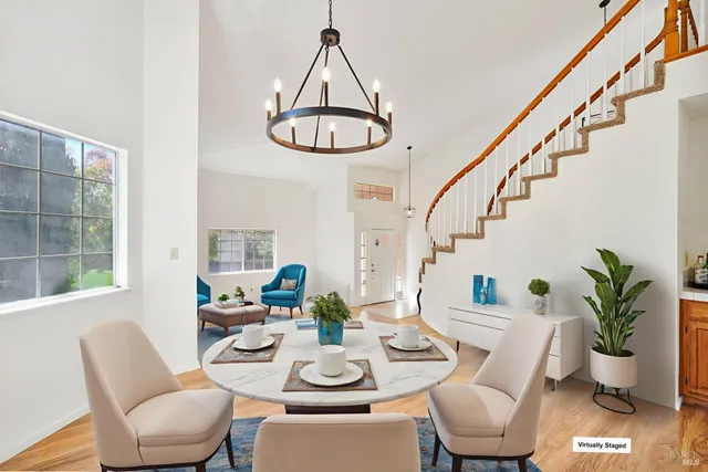 an empty room with closet and a chandelier fan