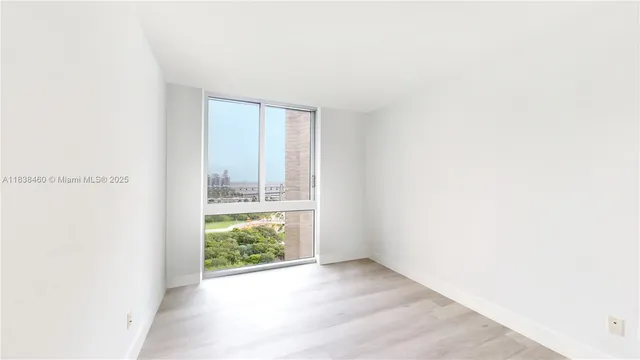 a view of an empty room and window