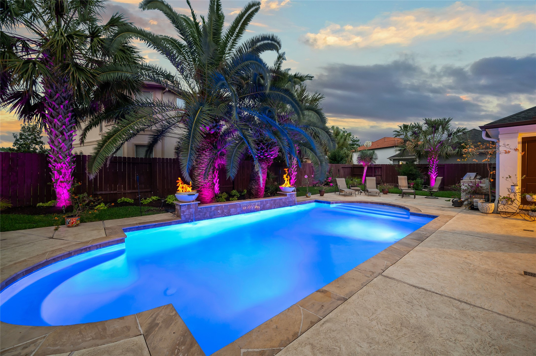2127 Thicket Ridge Lane Houston, TX 77077 - Photo 39 of 48 A masterpiece of aquatic design, meticulously resurfaced in 2025 and equipped with intelligent Hayward LED lighting. Seamlessly manage the ambiance from your phone, selecting from a curated spectrum of colors and light shows to create the ultimate nighttime spectacle in your lush, tropical oasis.
