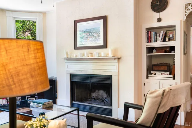 a living room with furniture and a fireplace