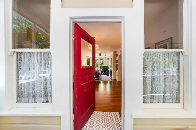 a view of livingroom with furniture and front door