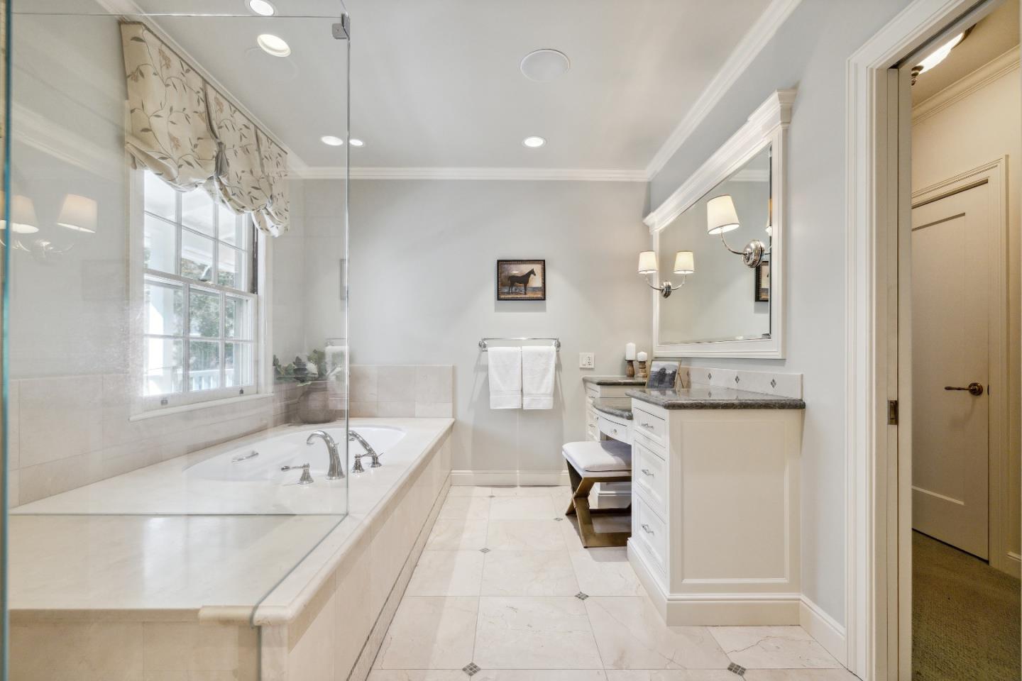 865 Culebra Road Hillsborough, CA 94010 - Photo 23 of 32 a bathroom with a tub sink and mirror
