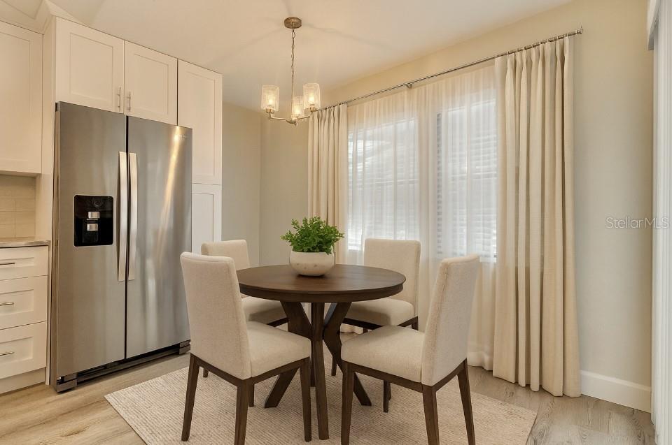 18917 Parade Road Hudson, FL 34667 - Photo 14 of 39 a view of a dining room with furniture window and wooden floor