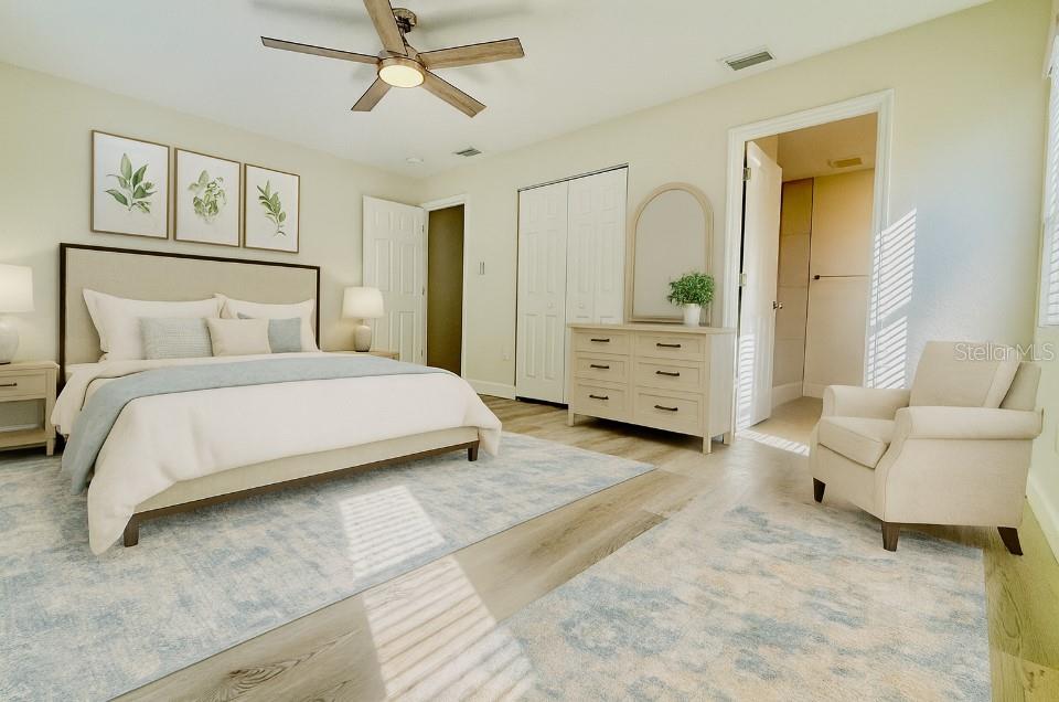 18917 Parade Road Hudson, FL 34667 - Photo 16 of 39 a bedroom with a bed and furniture