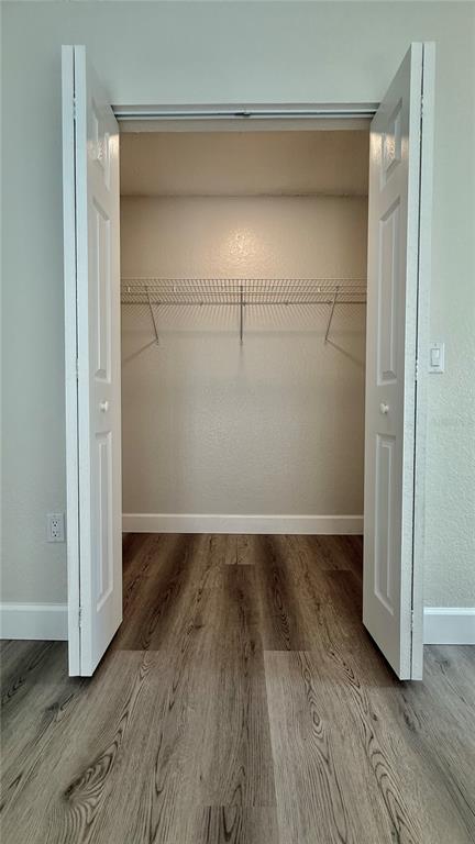 18917 Parade Road Hudson, FL 34667 - Photo 19 of 39 an empty room with wooden floor