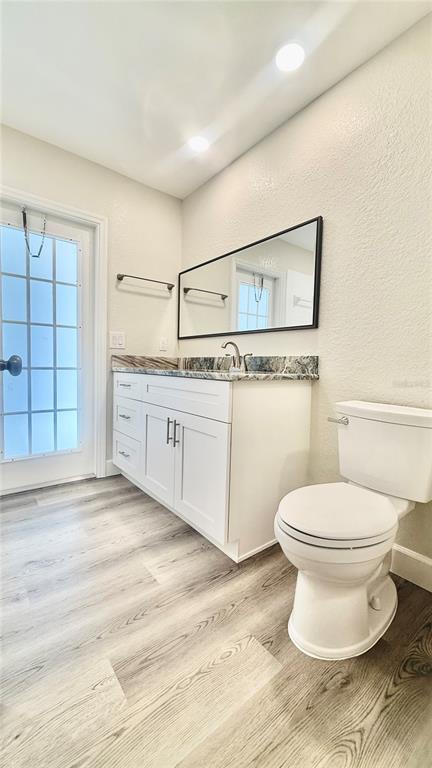 18917 Parade Road Hudson, FL 34667 - Photo 25 of 39 a bathroom with a sink toilet and window