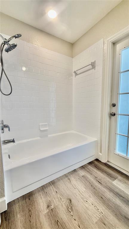 18917 Parade Road Hudson, FL 34667 - Photo 26 of 39 a bathroom with a bathtub and shower