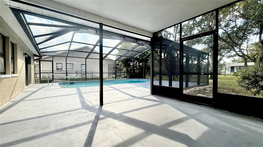 18917 Parade Road Hudson, FL 34667 - Photo 30 of 39 a view of a porch with a glass door