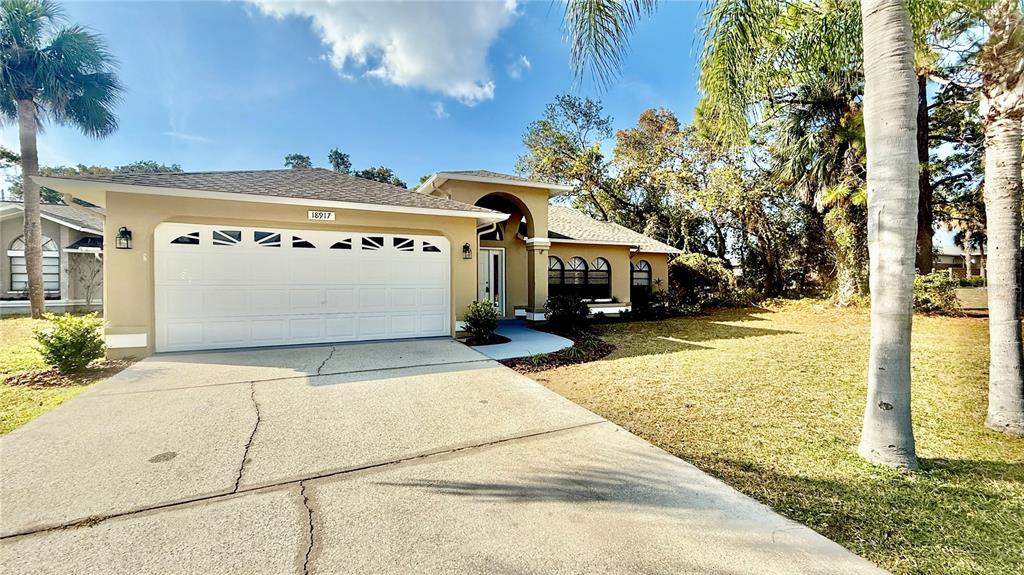 18917 Parade Road Hudson, FL 34667 - Photo 3 of 39 a view of a building with street