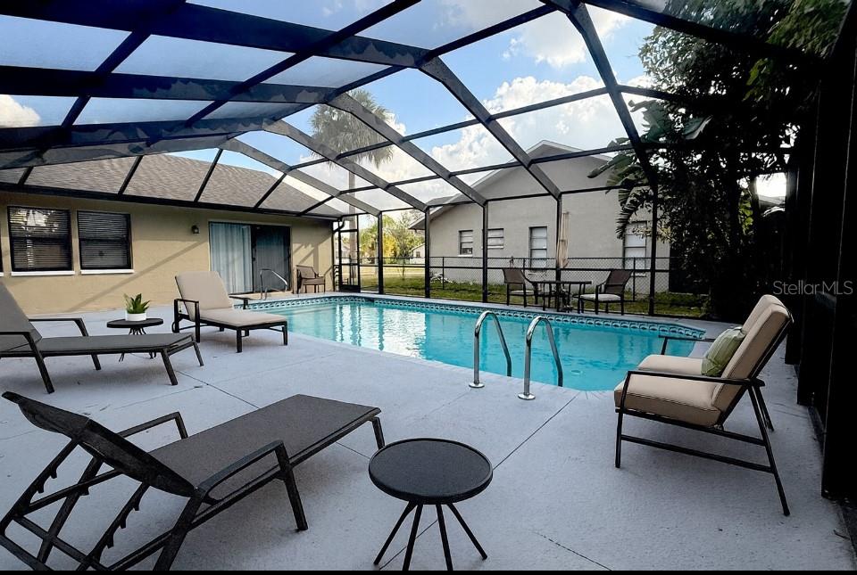 18917 Parade Road Hudson, FL 34667 - Photo 31 of 39 a building outdoor space with patio furniture and a potted plant