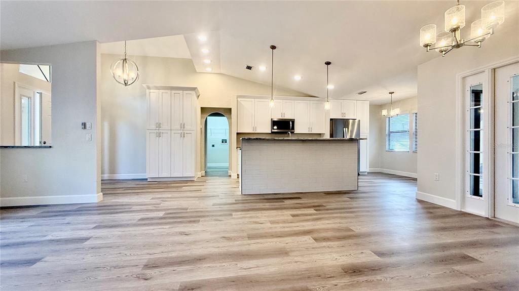 18917 Parade Road Hudson, FL 34667 - Photo 10 of 39 a view of kitchen with cabinets appliances and wooden floor