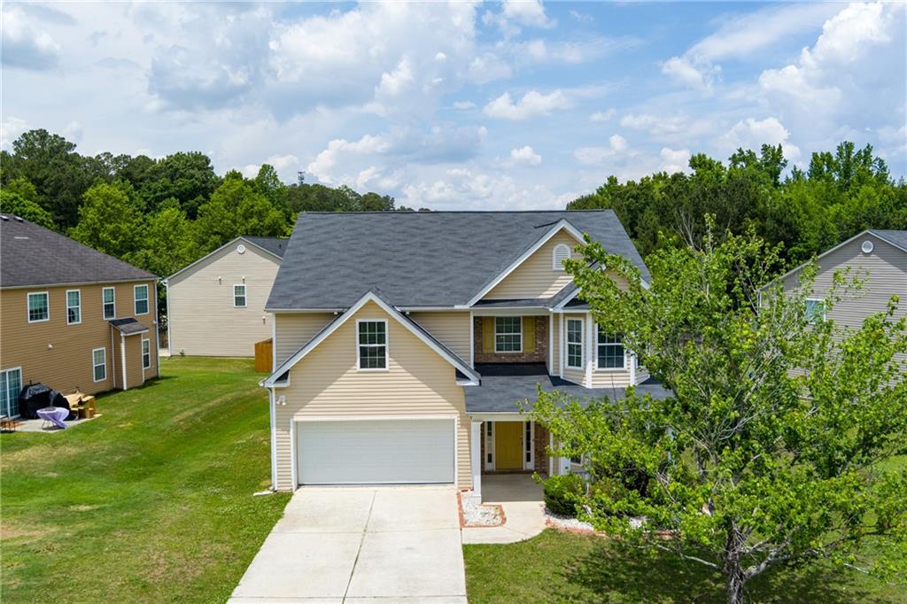 375 Walton View Fairburn, GA 30213 - Photo 33 of 38 a front view of a house with garden