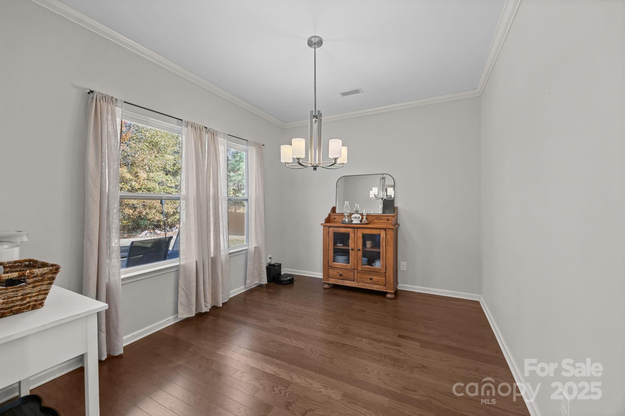 125 Devynn Ridge Court Mount Holly, NC 28120 - Photo 18 of 47 a view of an empty room with window and wooden floor