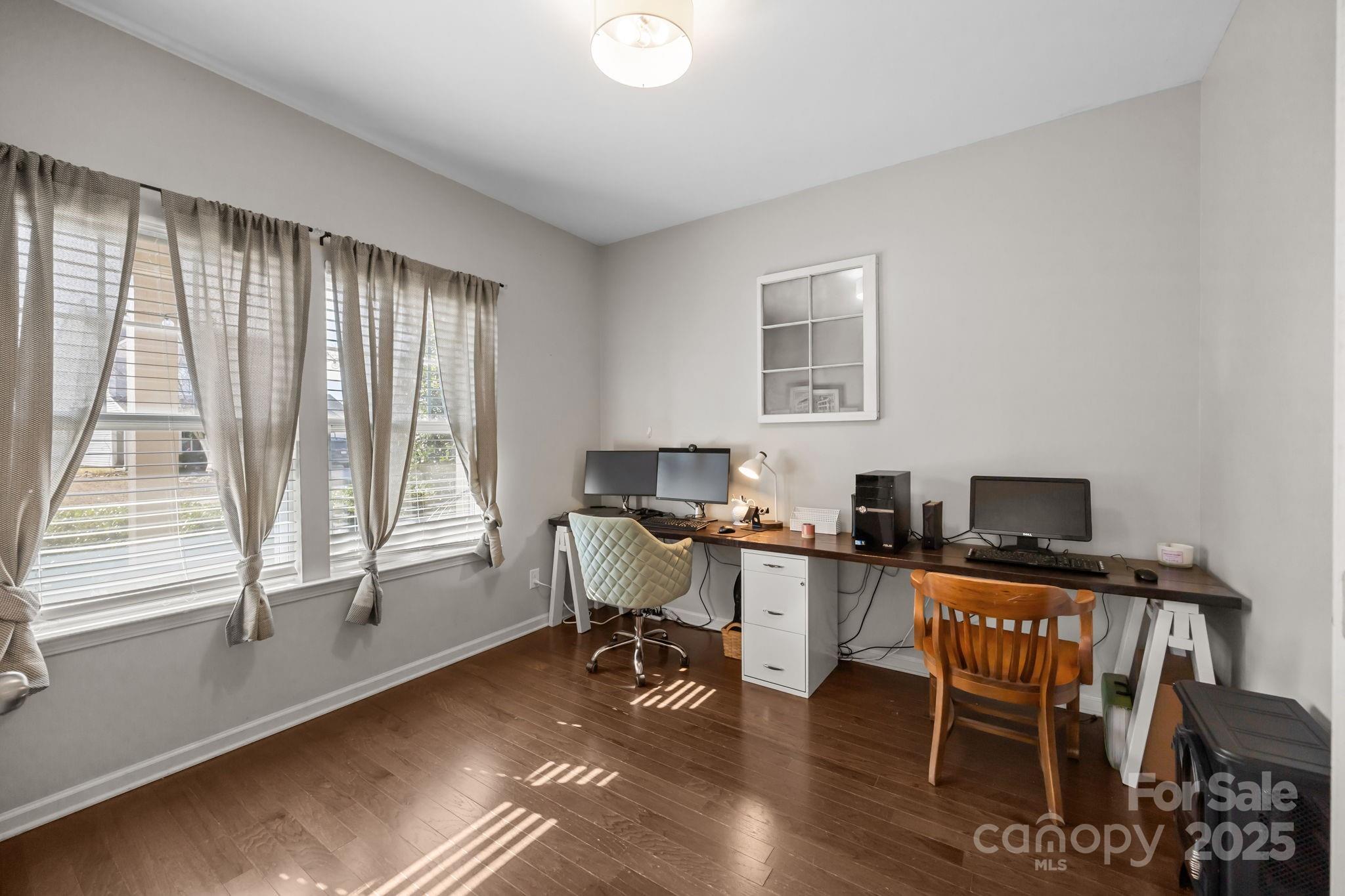 125 Devynn Ridge Court Mount Holly, NC 28120 - Photo 19 of 47 a workspace with wooden floor and a window