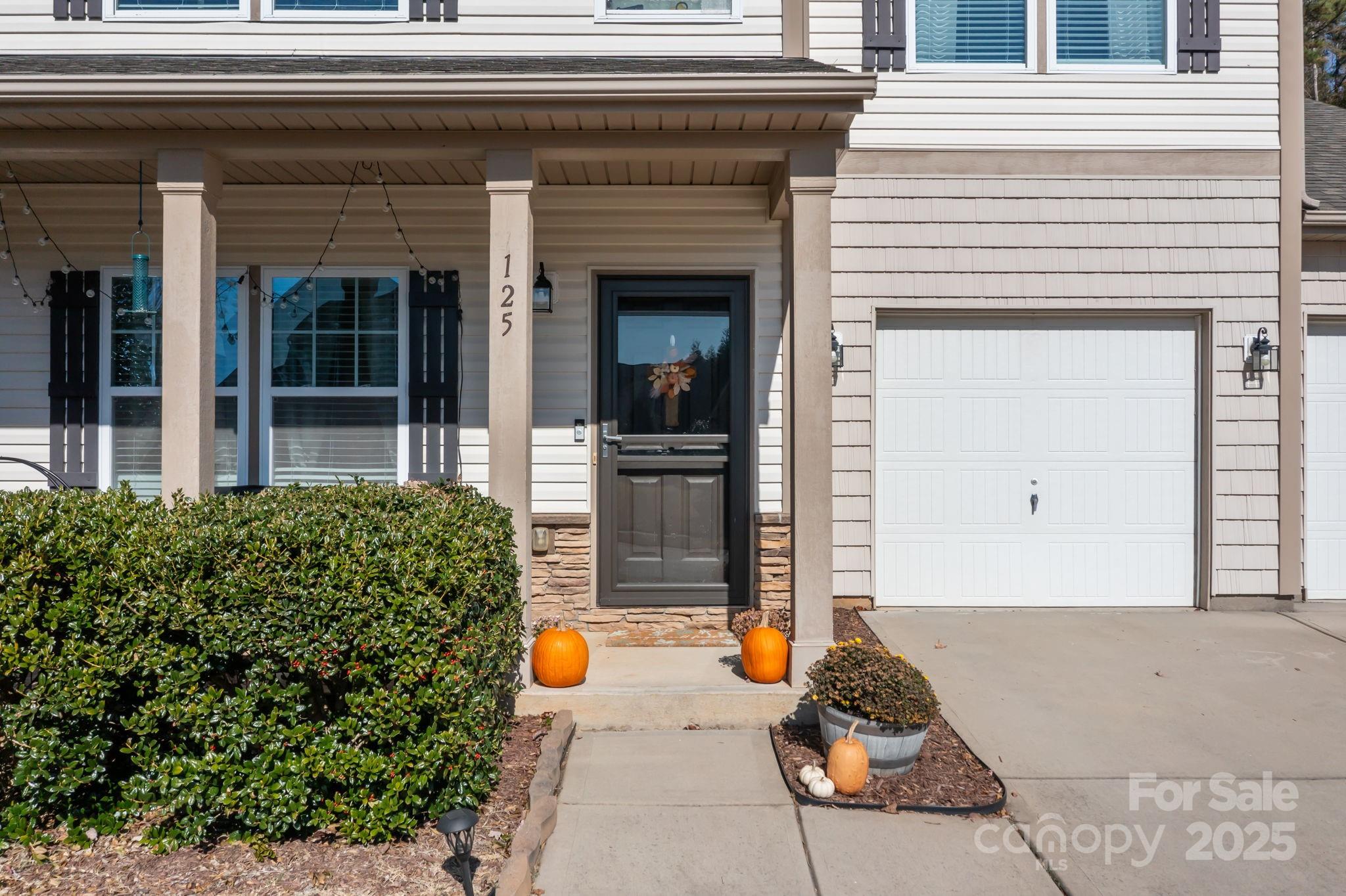 125 Devynn Ridge Court Mount Holly, NC 28120 - Photo 22 of 47 a front view of a house with outdoor seating