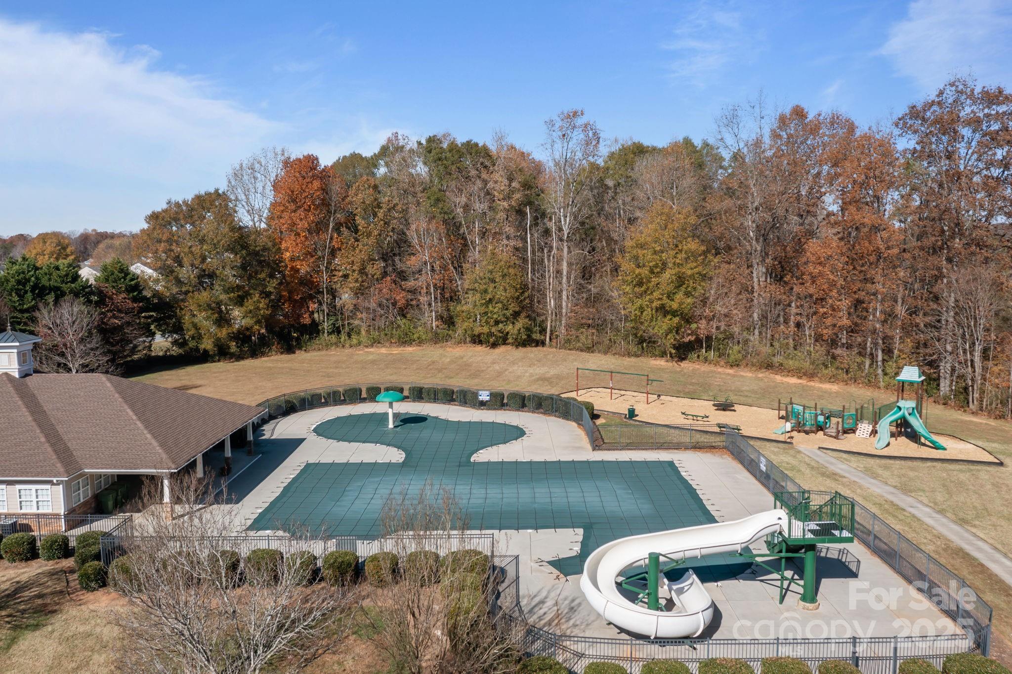 125 Devynn Ridge Court Mount Holly, NC 28120 - Photo 26 of 47 an aerial view of a house with yard and trees in the background
