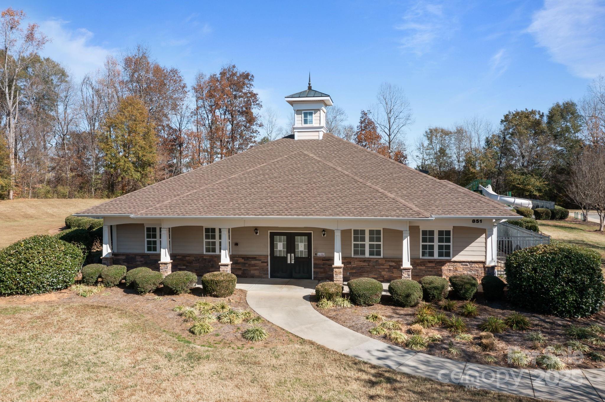 125 Devynn Ridge Court Mount Holly, NC 28120 - Photo 31 of 47 a front view of a house with a yard outdoor seating