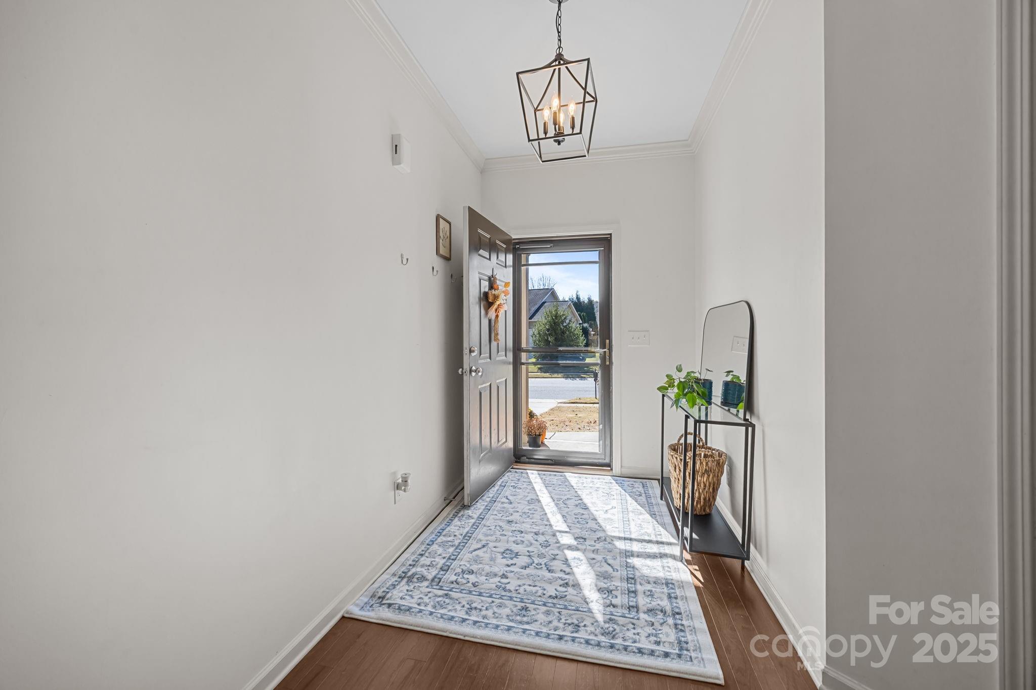 125 Devynn Ridge Court Mount Holly, NC 28120 - Photo 33 of 47 a view of empty room with floor to ceiling window