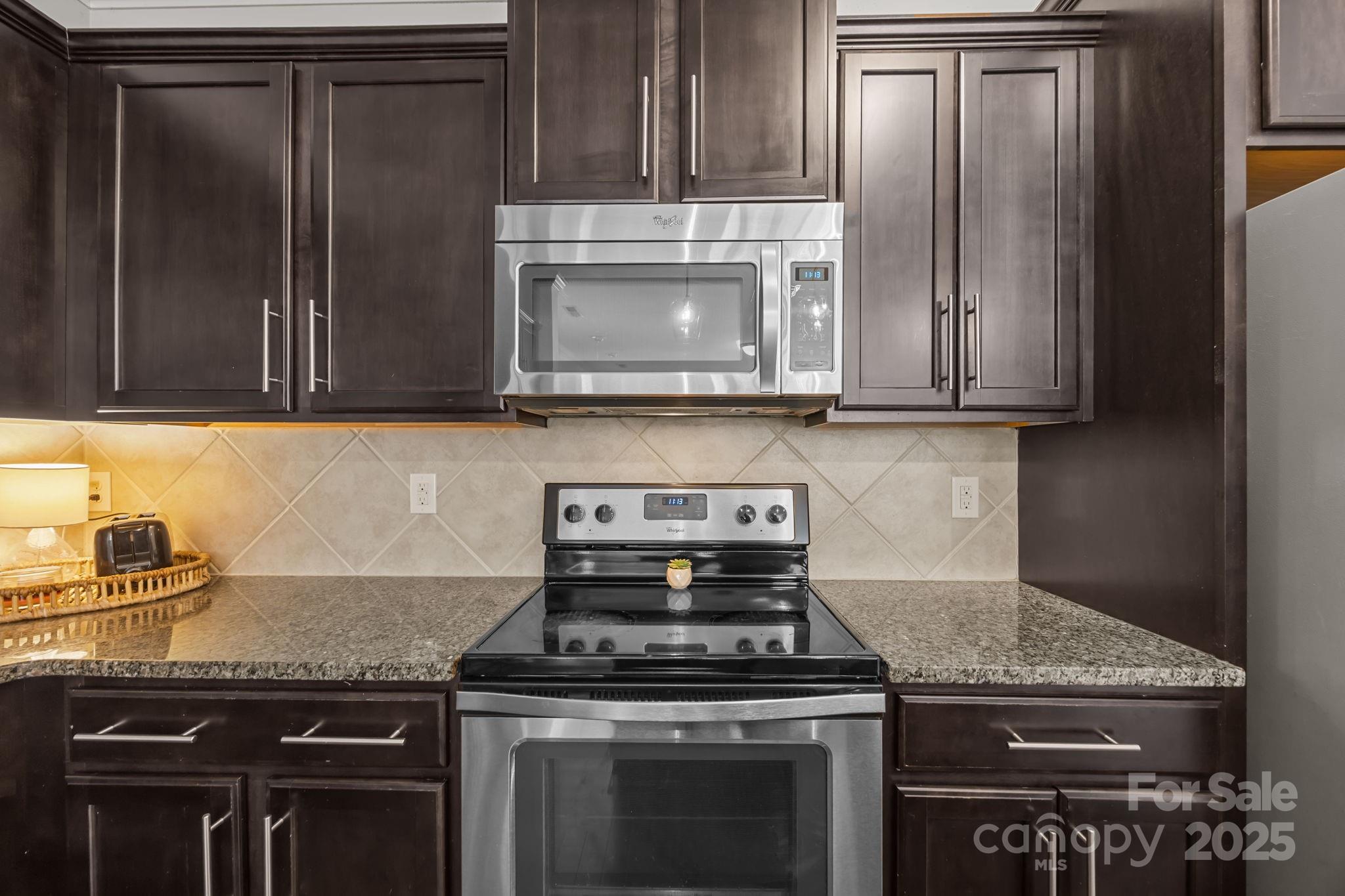 125 Devynn Ridge Court Mount Holly, NC 28120 - Photo 38 of 47 a stove top oven sitting inside of a kitchen