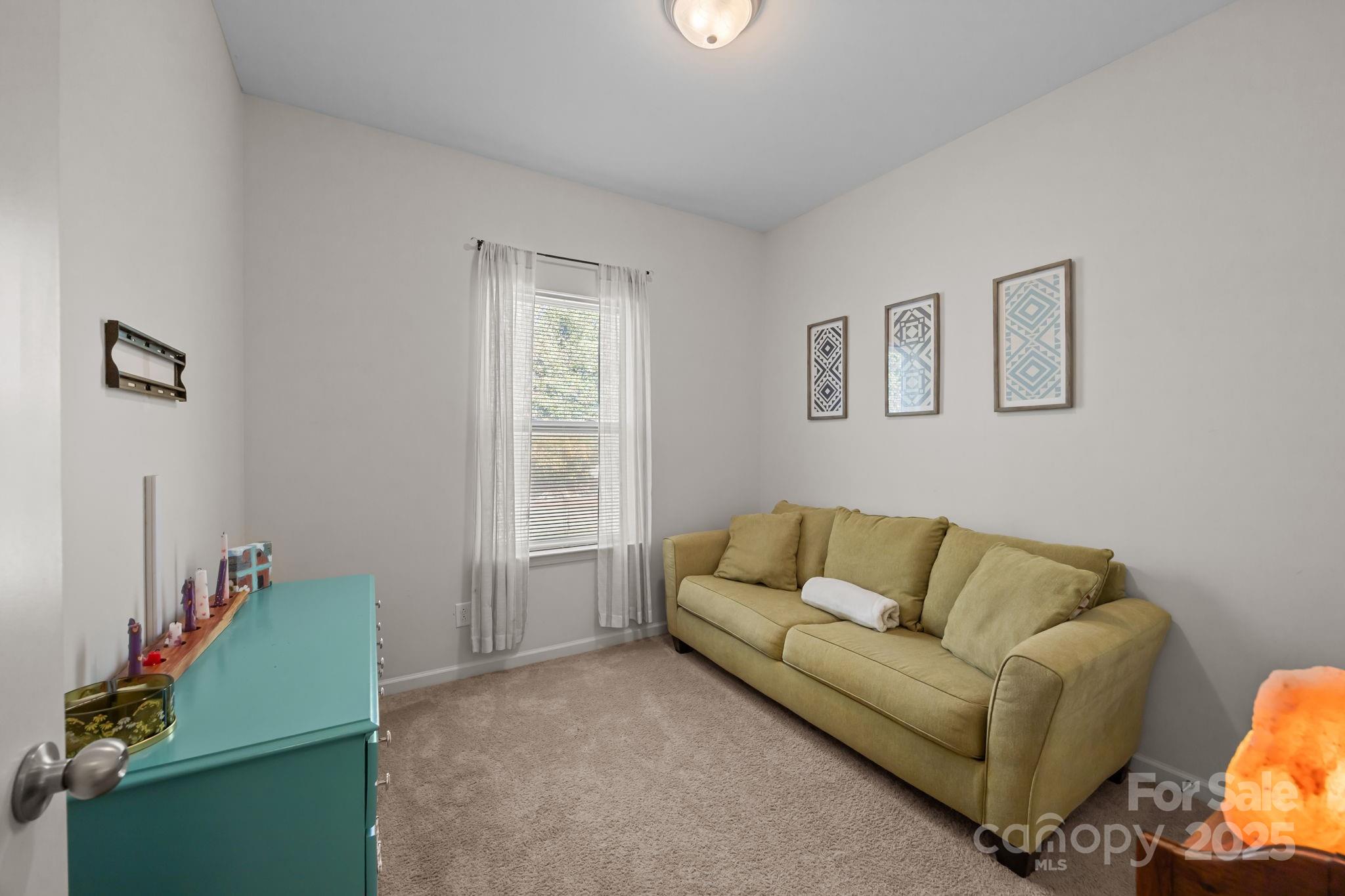 125 Devynn Ridge Court Mount Holly, NC 28120 - Photo 40 of 47 a living room with furniture and a window