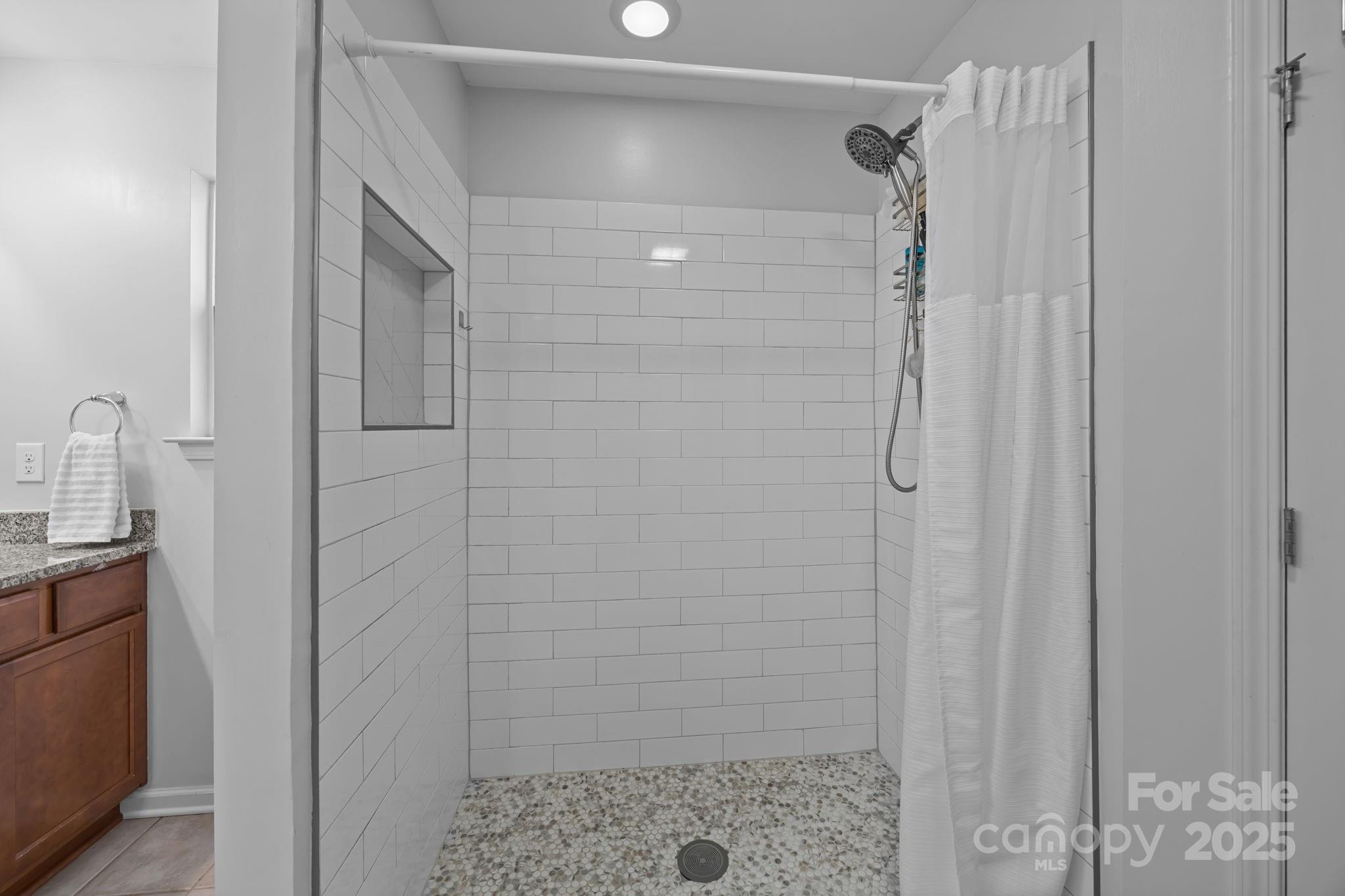 125 Devynn Ridge Court Mount Holly, NC 28120 - Photo 45 of 47 a bathroom with a shower