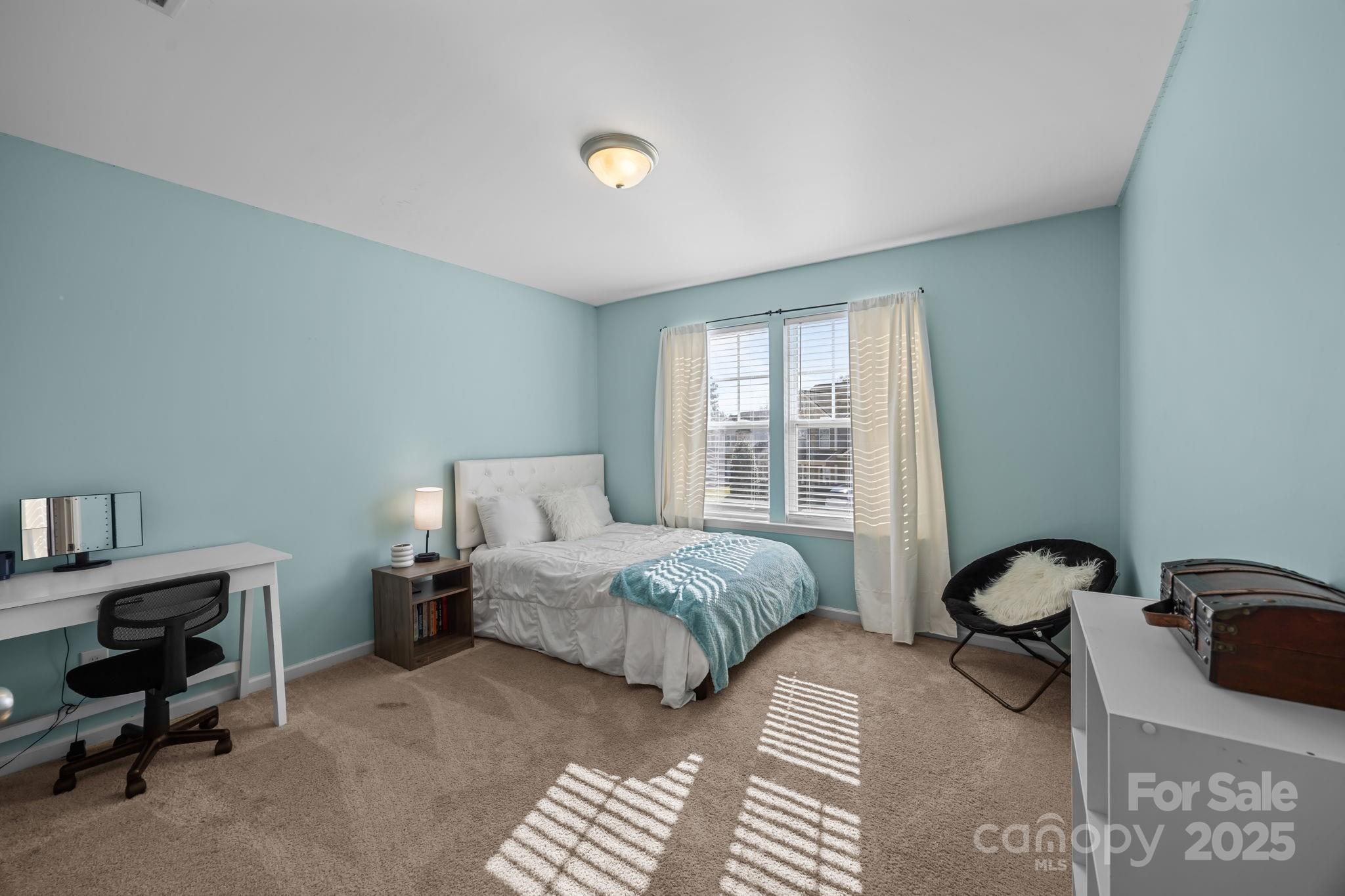 125 Devynn Ridge Court Mount Holly, NC 28120 - Photo 9 of 47 a bedroom with furniture and a window