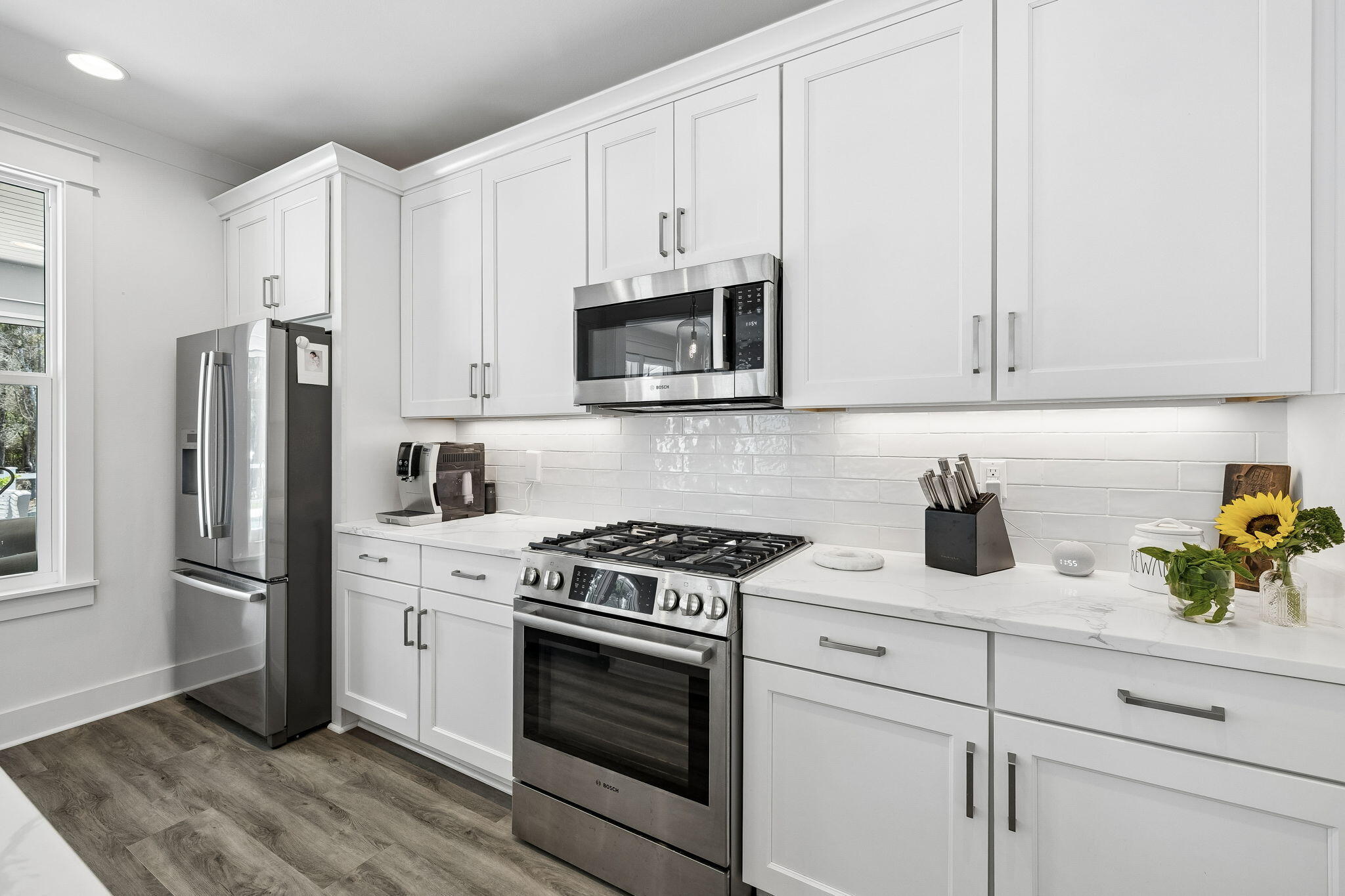 115 Log Landing St Inlet Beach Inlet Beach, FL 32461 - Photo 19 of 69 a kitchen with white cabinets and stainless steel appliances