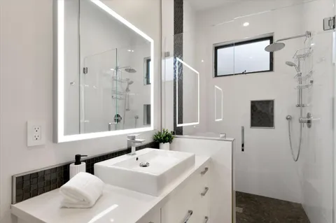 a bathroom with a sink and a mirror