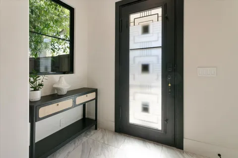 a bathroom with a double vanity sink and mirror