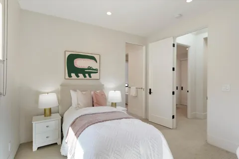 a bed room with a bed and a window