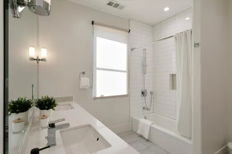 a view of storage and utility room with washer and dryer