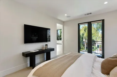 a bathroom with a double vanity sink and a large mirror