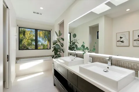 a bathroom with a shower and a sink