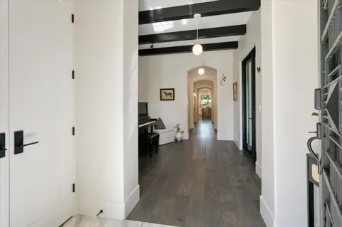 a view of a hallway with a room