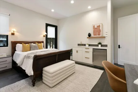 a bedroom with a bed and furniture