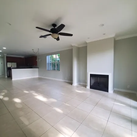 a view of an empty room with a fireplace