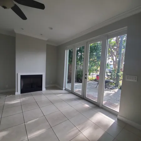 a view of an empty room with glass door