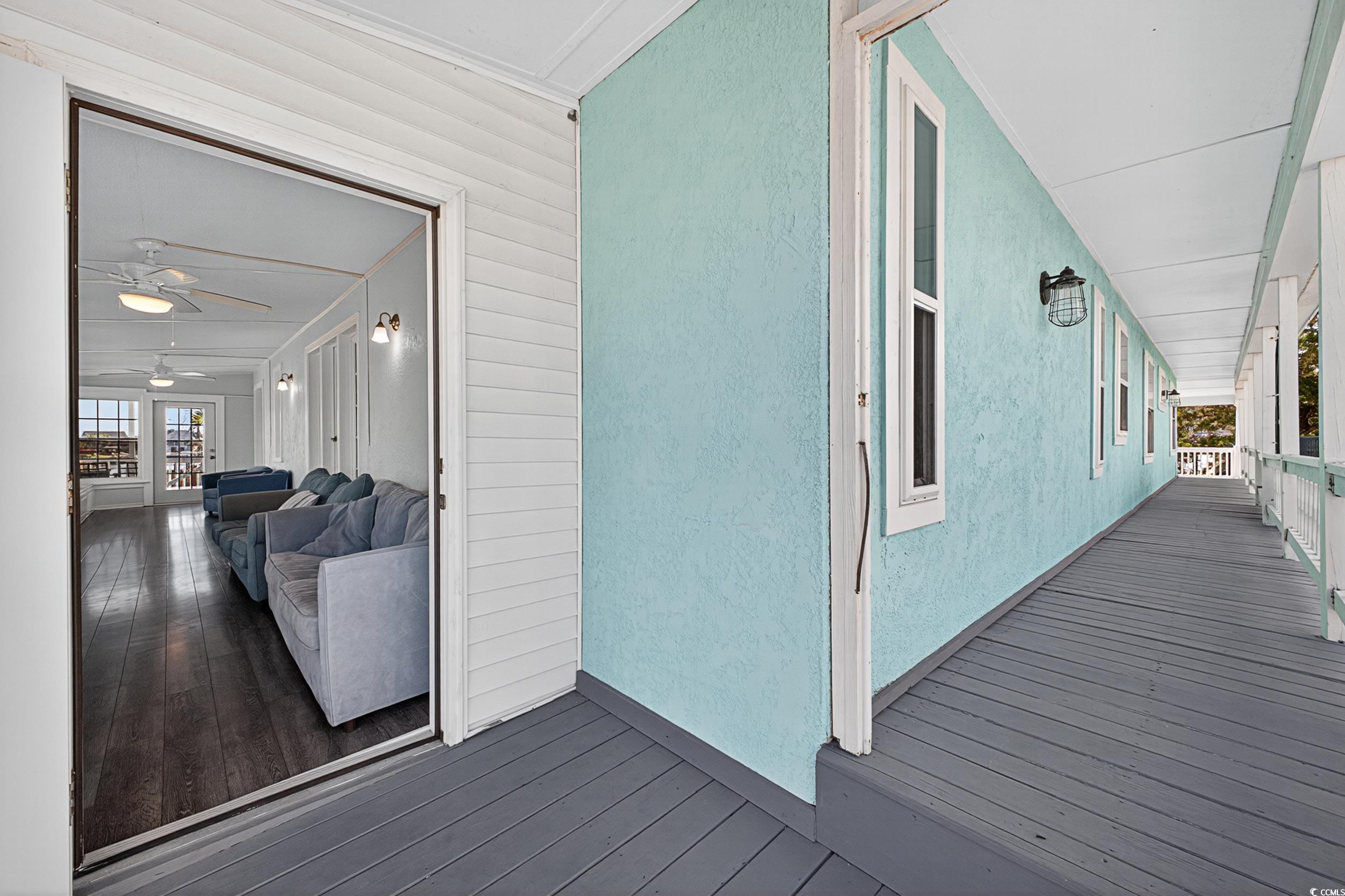 1885 Pompano Drive Murrells Inlet, SC 29576 - Photo 21 of 34 Wooden deck with a ceiling fan