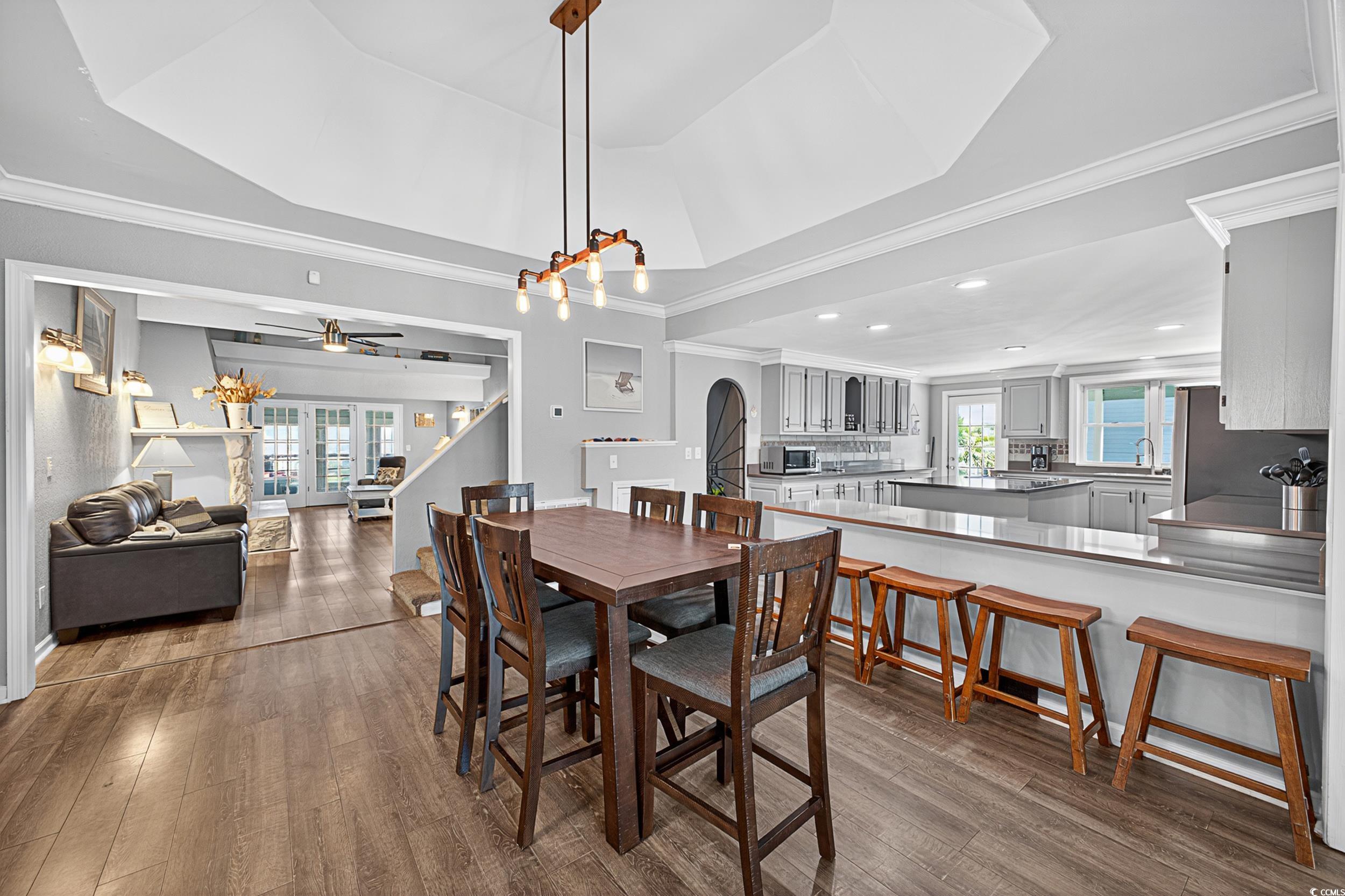 1885 Pompano Drive Murrells Inlet, SC 29576 - Photo 24 of 34 Dining space with healthy amount of natural light, dark wood-style flooring, ceiling fan, arched walkways, and recessed lighting
